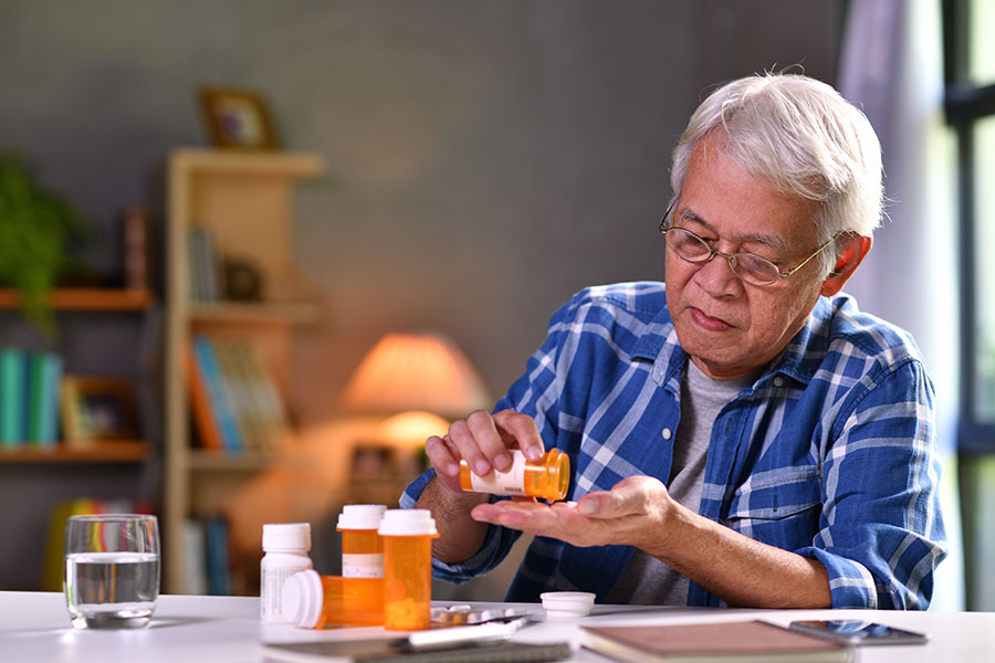 senior with medications