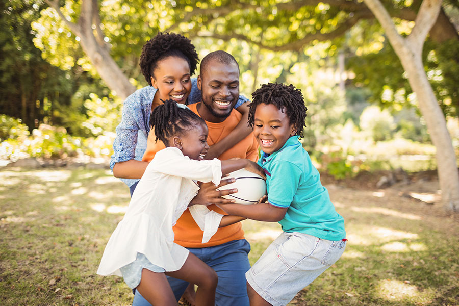 happy family playing with a basketball
