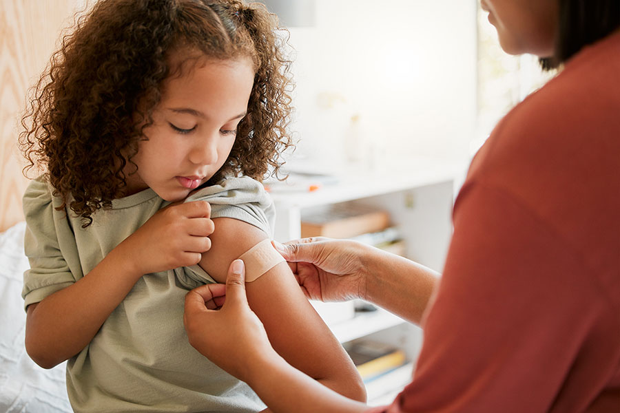 child receiving a vaccine