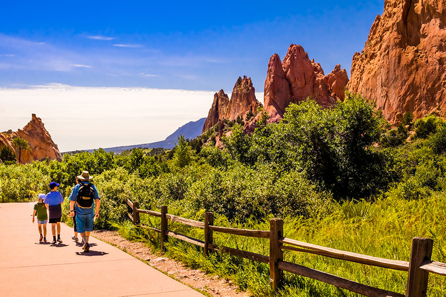 Colorado family hiking through Garden of the Gods Colorado family hiking through Garden of the Gods